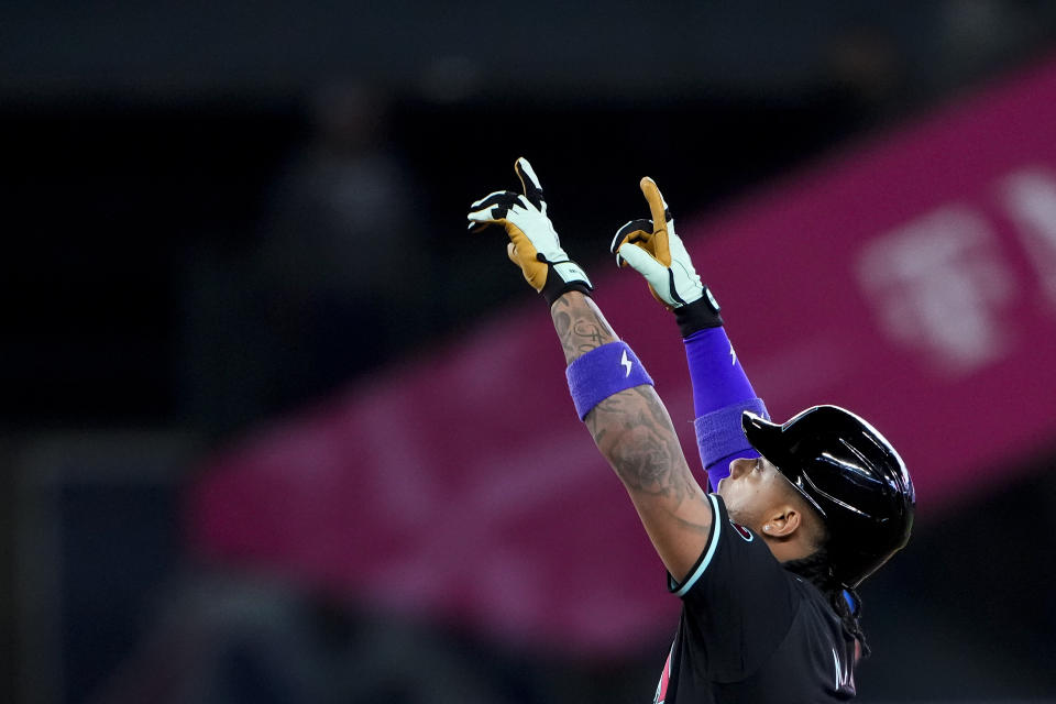 Arizona Diamondbacks' Ketel Marte points after hitting an RBI double against the Seattle Mariners during the eighth inning of a baseball game Sunday, April 28, 2024, in Seattle. (AP Photo/Lindsey Wasson)