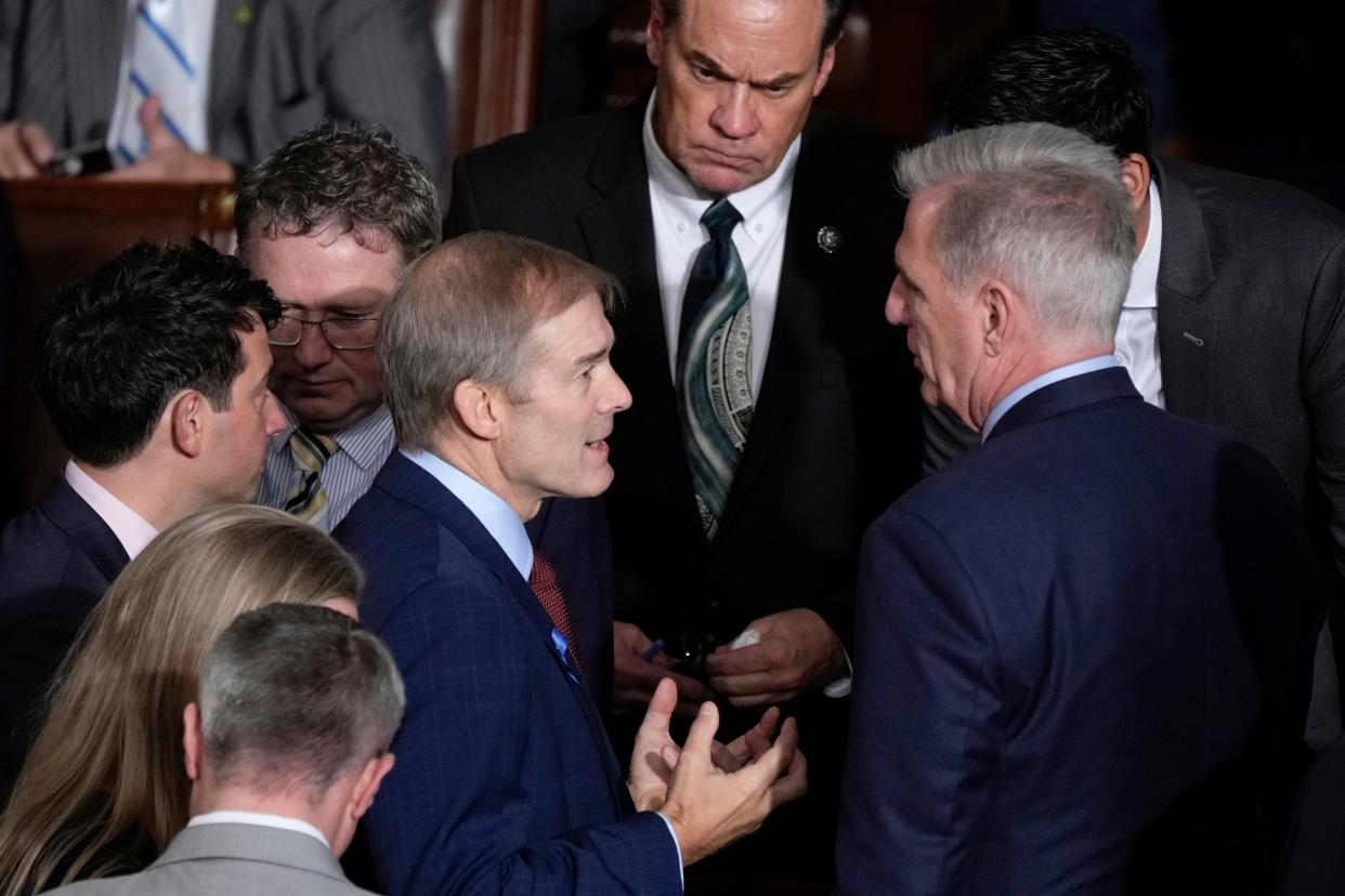 Rep. Jim Jordan, R-Ohio, chairman of the House Judiciary Committee, talks with former Speaker Rep. Kevin McCarthy, R-Calif., right, as the House convenes for a second day of balloting to elect a speaker, at the Capitol in Washington, Wednesday, Oct. 18, 2023. Rep. Thomas Massie, R-Ky., second from left behind Jordan, and Rep. Russ Fulcher, R-Idaho, top center, look on. (AP Photo/J. Scott Applewhite)