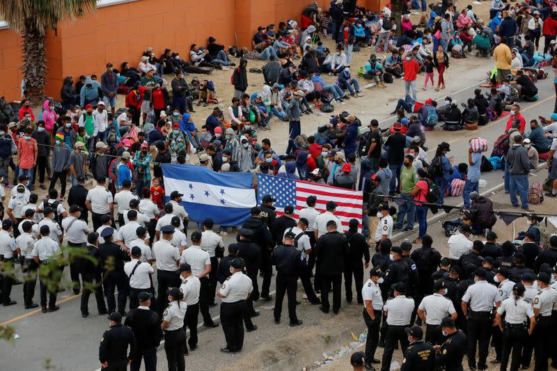 FILE PHOTO: Hondurans take part in a new caravan of migrants, set to head to the United States, in Vado Hondo