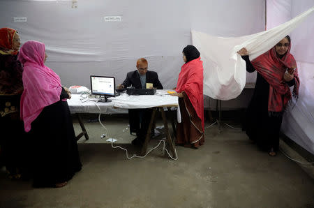 People vote for the first time with Electronic Voting Machine (EVM) which was placed in a few voting centers in Dhaka, Bangladesh December 30, 2018. REUTERS/Mohammad Ponir Hossain