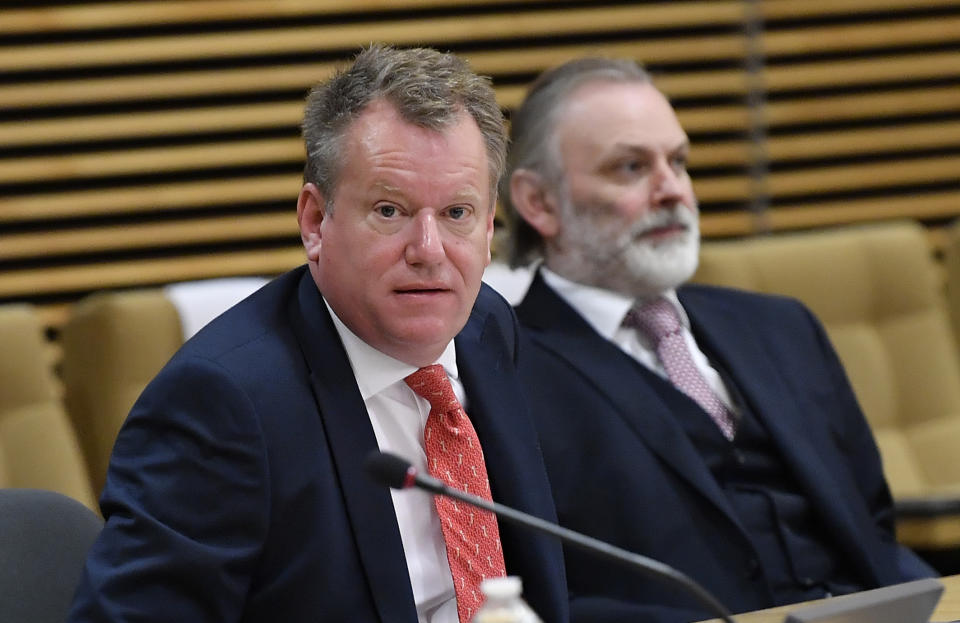 British Brexit negotiator David Frost, left, and Britain's Ambassador to the European Union Tim Barrow prior to the start of further negotiations at the EU headquarters in Brussels, Monday, June 29, 2020. European Union and U.K. negotiators resumed in-person talks on a post-Brexit trade deal on Monday, with both sides insisting that the process must accelerate markedly if they're to reach an agreement by the end of the year. (John Thys, Pool Photo via AP)