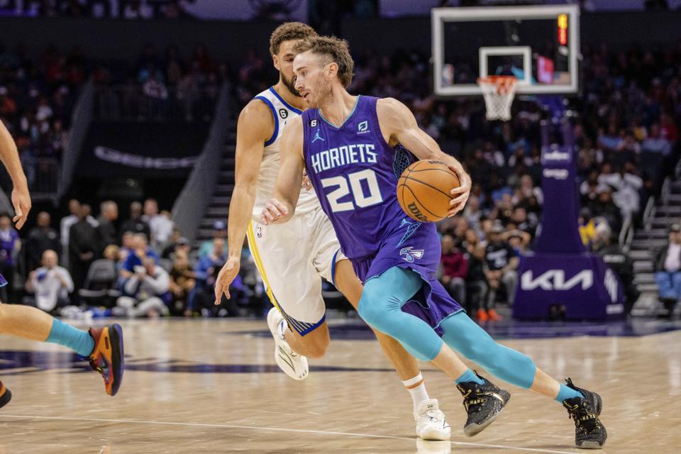 Charlotte Hornets forward Gordon Hayward (20) drives with the ball during the first half of an NBA basketball game on Saturday, Oct. 29, 2022, in Charlotte, N.C. (AP Photo/Scott Kinser)
