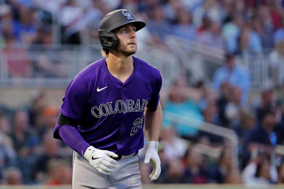 Colorado Rockies' Ryan McMahon watches his solo home run go against the Minnesota Twins in the eighth inning of a baseball game Tuesday, June 11, 2024, in Minneapolis. (AP Photo/Bruce Kluckhohn)