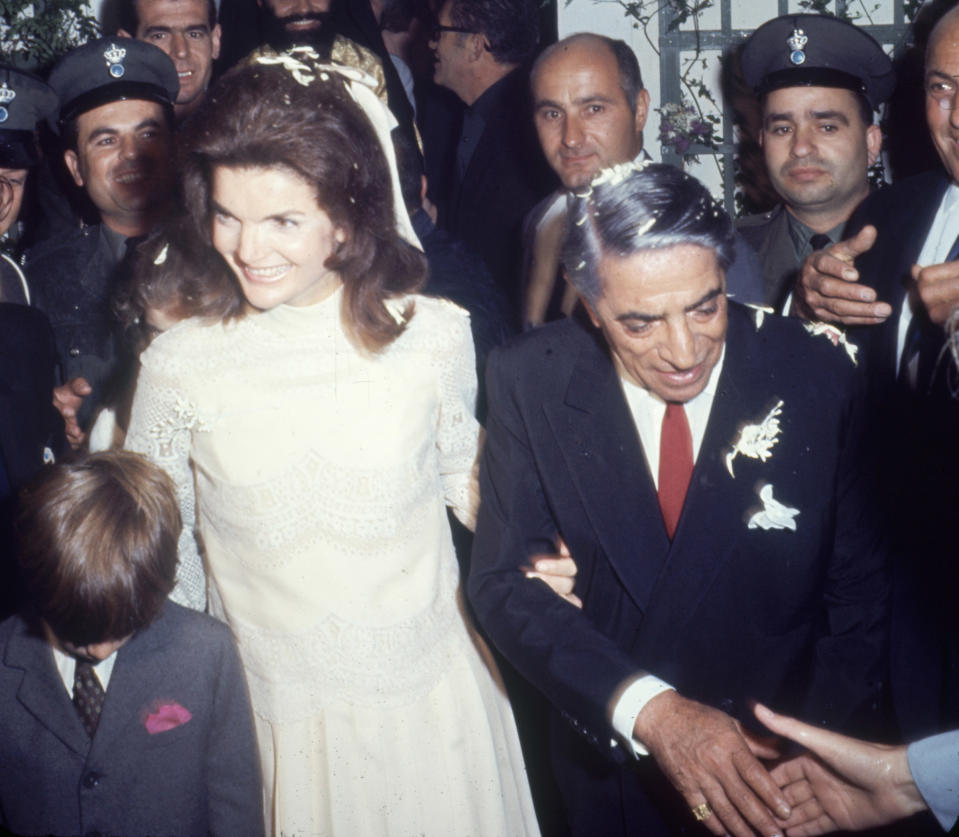 after their wedding in Scorpios, Greece on Oct. 20, 1968. Kennedy's son, John Kennedy Jr. is at left, fore.