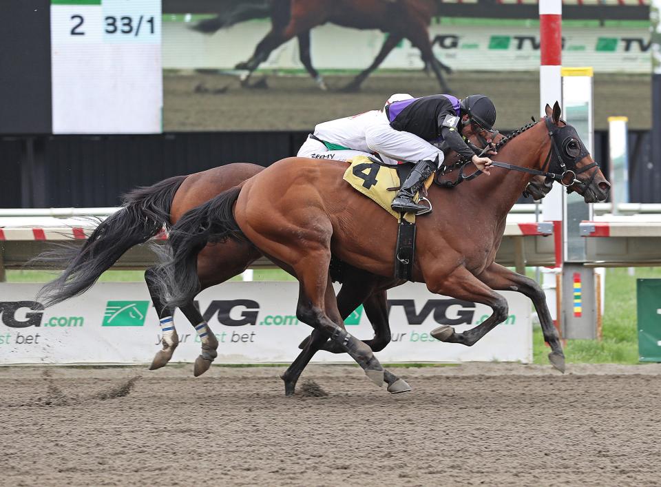 Howgreatisnate (4) with Jairo Rendon riding won close finish over Offaly Cool and Jeremy Laprida in the $100,000 Long Branch Stakes on Opening Day at Monmouth Park Racetrack in Oceanport, NJ.