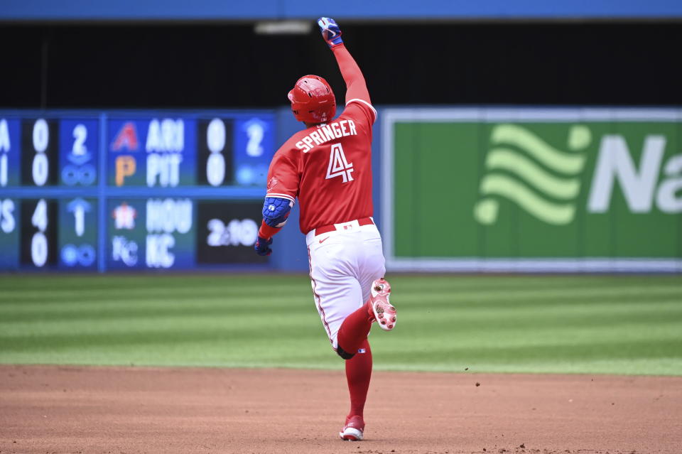 Toronto Blue Jays' George Springer (4) rounds the bases after hitting a solo home run against the Minnesota Twins in the first inning of a baseball game in Toronto, Sunday, June 5, 2022. (Jon Blacker/The Canadian Press via AP)