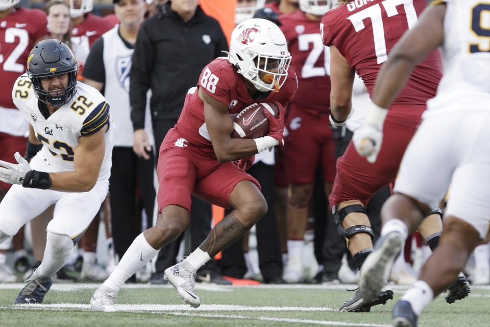 Washington State wide receiver De'Zhaun Stribling carries the ball during the second half of an NCAA college football game, Saturday, Oct. 1, 2022, in Pullman, Wash. (AP Photo/Young Kwak)