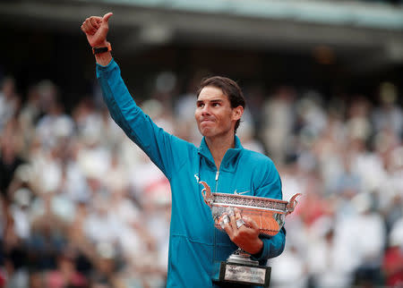 Tennis - French Open - Roland Garros, Paris, France - June 10, 2018 Spain's Rafael Nadal celebrates with the trophy after winning the final against Austria's Dominic Thiem REUTERS/Benoit Tessier