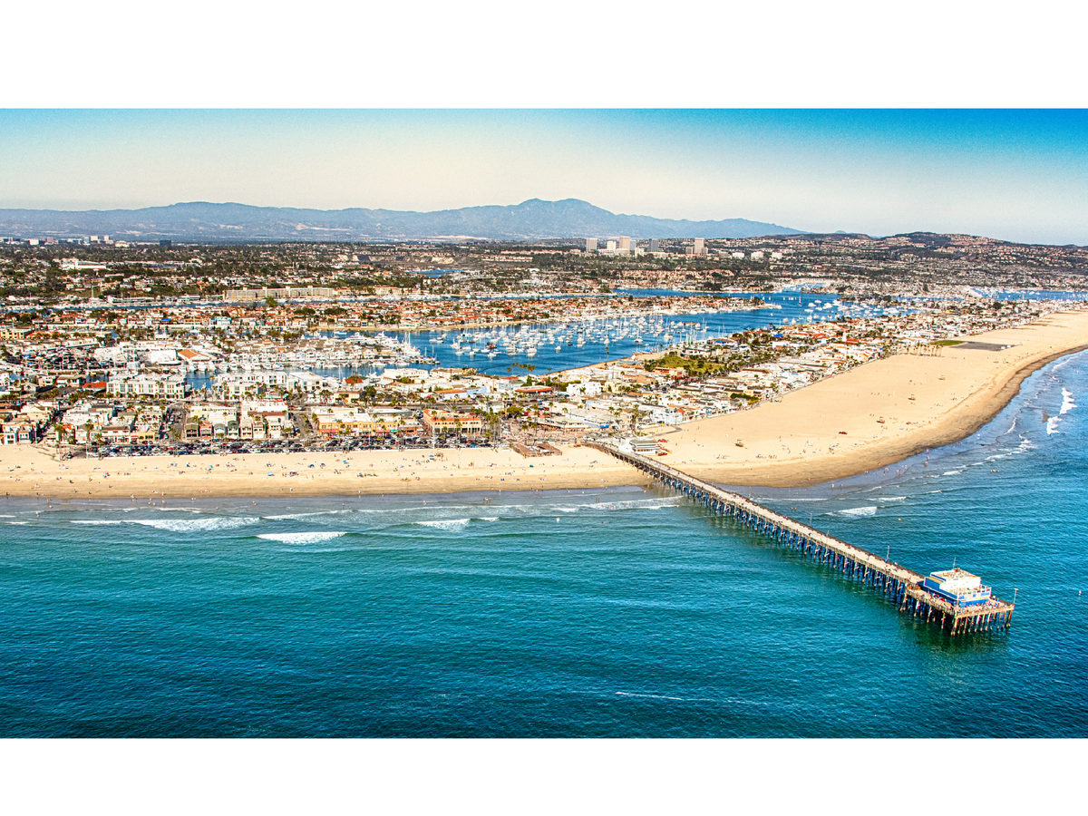 A farmer’s market is held every Sunday next to Newport Beach’s famous pier (Getty / iStock)