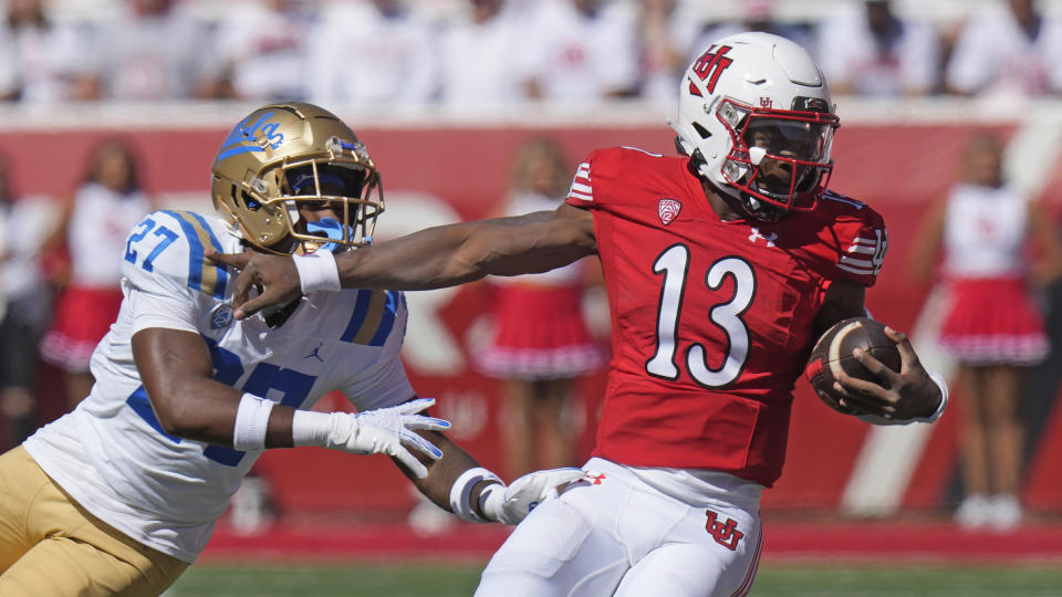 Utah quarterback Nate Johnson (13) is tackled by UCLA defensive back Kamari Ramsey (27) during the first half of an NCAA college football game, Saturday, Sept. 23, 2023, in Salt Lake City. (AP Photo/Rick Bowmer)