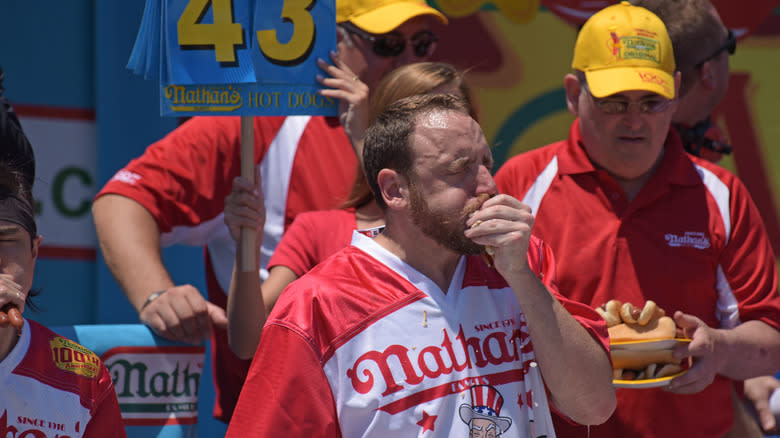 Joey Chestnut eating hot dogs