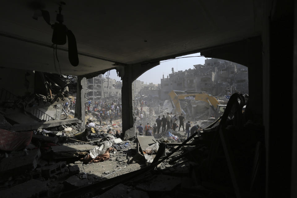 FILE - Palestinians work among debris of buildings that were targeted by Israeli airstrikes in Jabaliya refugee camp, northern Gaza Strip, Wednesday, Nov. 1, 2023. Weeks after ordering northern Gaza's 1.1 million inhabitants to evacuate south, the Israeli army is intensifying its bombing of the area that stretches to the wetlands of Wadi Gaza. Israeli soldiers are also battling Hamas militants just north of Gaza City. It's the start of what officials expect to be a long and bloody invasion that has already pinned down hundreds of thousands of Palestinians who remain in the north. (AP Photo/Abed Khaled, File)