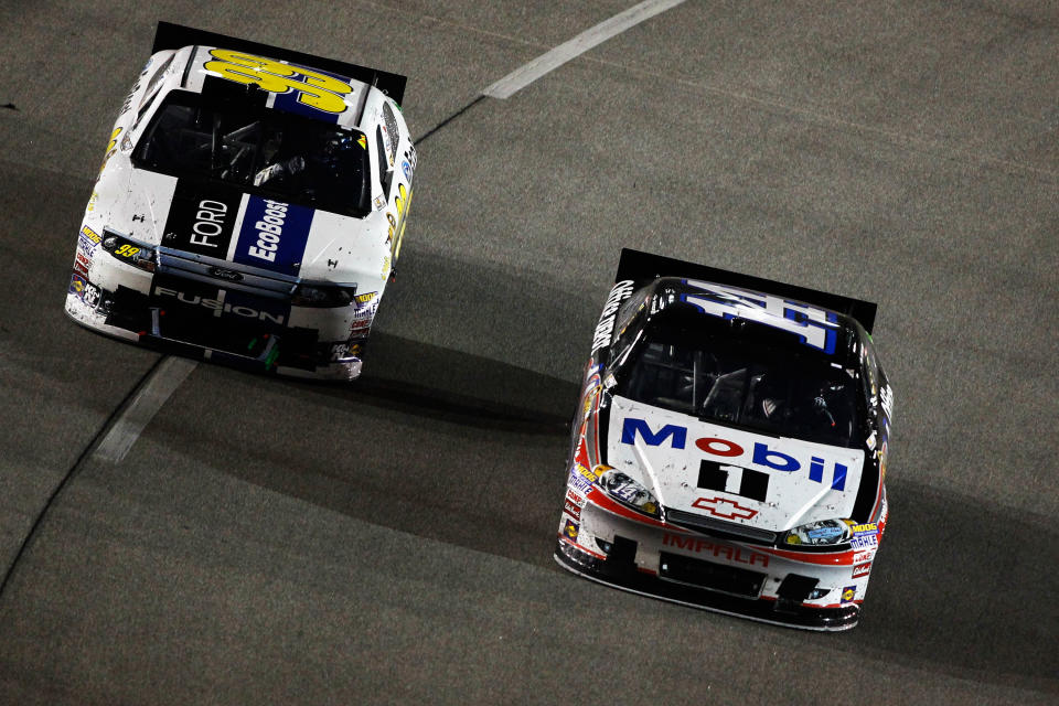 RICHMOND, VA - APRIL 28: Tony Stewart, driver of the #14 Mobil 1/Office Depot Chevrolet, races Carl Edwards, driver of the #99 Eco-Boost Ford, during the NASCAR Sprint Cup Series Capital City 400 at Richmond International Raceway on April 28, 2012 in Richmond, Virginia. (Photo by Todd Warshaw/Getty Images for NASCAR)