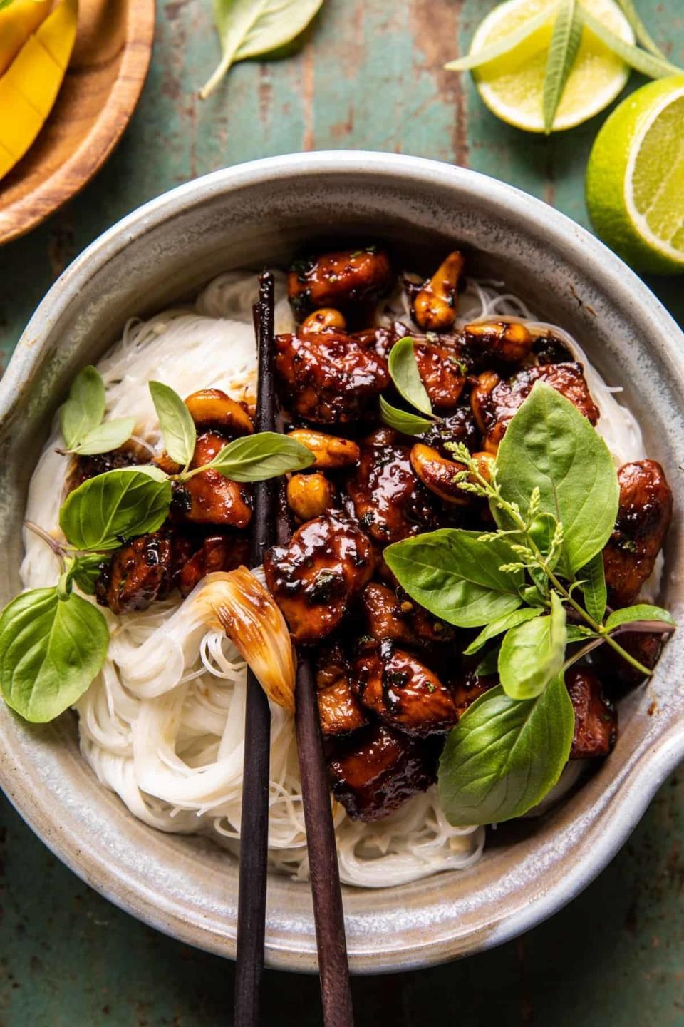 Apricot chicken and cashews over rice noodles