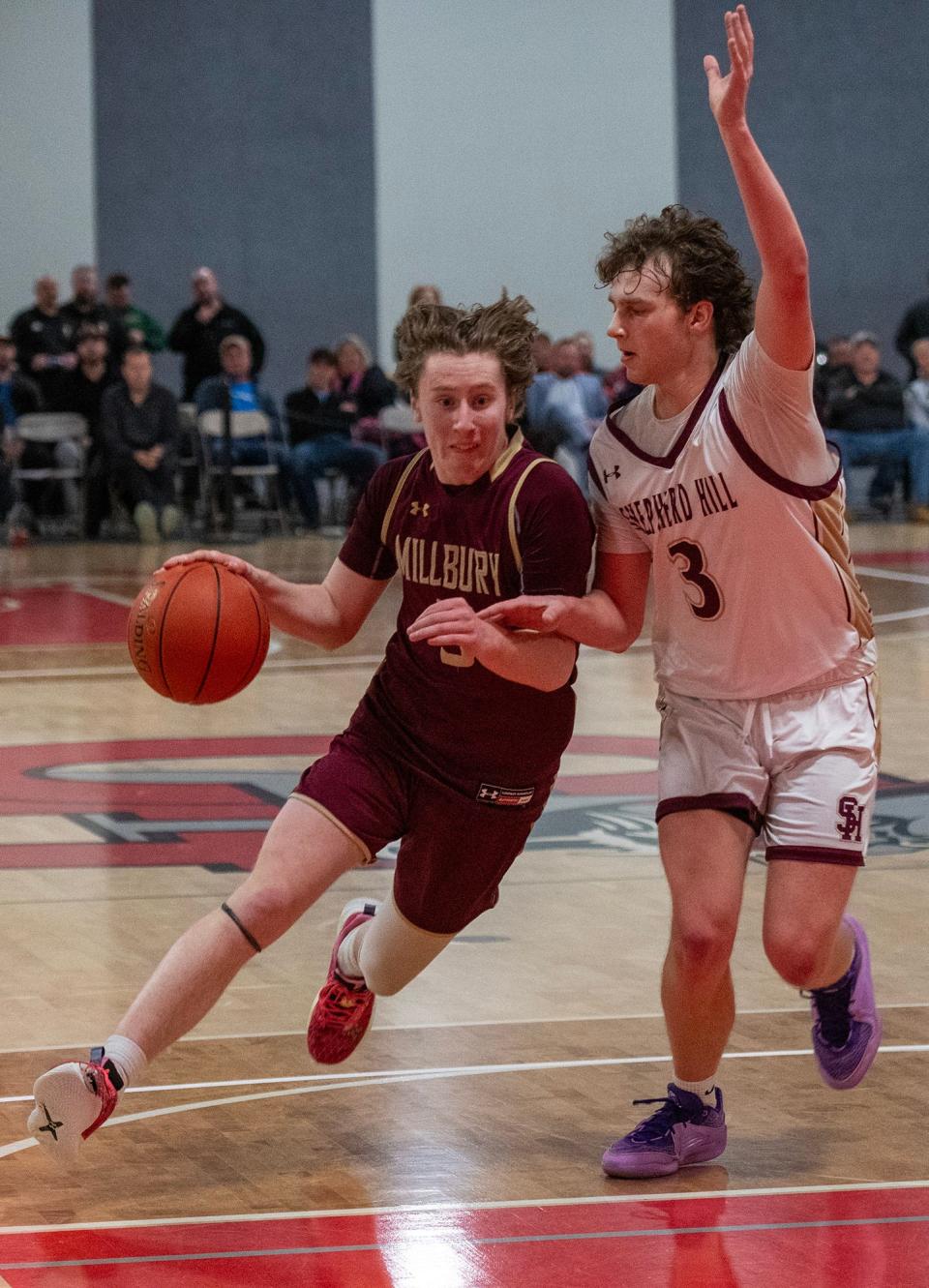 Millbury’s Jimmer Donnelly moves past Shepherd Hill’s Lucas Miglionico.
