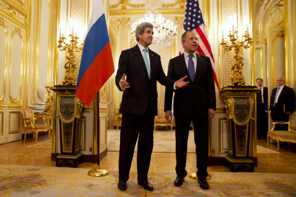 U.S. Secretary of State John Kerry, left, gestures as he and Russian Foreign Minister Sergey Lavrov meet at the Russian Ambassador's Residence to discuss Ukraine, in Paris Sunday March 30, 2014. Kerry traveled to Paris for a last minute meeting with Lavrov. (AP Photo/Jacquelyn Martin, Pool)