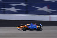 Scott Dixon, of New Zealand, heads into the first turn during qualifications for the Indianapolis 500 auto race at Indianapolis Motor Speedway in Indianapolis, Sunday, May 22, 2022. (AP Photo/Michael Conroy)