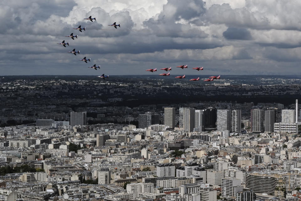 French Alpha jets of the Patrouille de France and the UK Royal red arrows aerobatic planes fly over west of Paris, Thursday, June 18, 2020 as part of commemoration for the 80th anniversary of Charles de Gaulle's radio appeal to his countrymen to resist Nazi occupation during WWII. French President Emmanuel Macron is traveling to London to mark the day that De Gaulle delivered his defiant broadcast 80 years ago urging his nation to fight on despite the fall of France. In a reflection of the importance of the event, the trip marks Macron's first international trip since France's lockdown amid the COVID-19 pandemic. (AP Photo/Francois Mori)