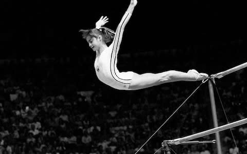 Comaneci earned seven perfect 10s, helping the Romanian gymnastics team to their first Olympic silver medal for the team event in 1976 - Credit: AP