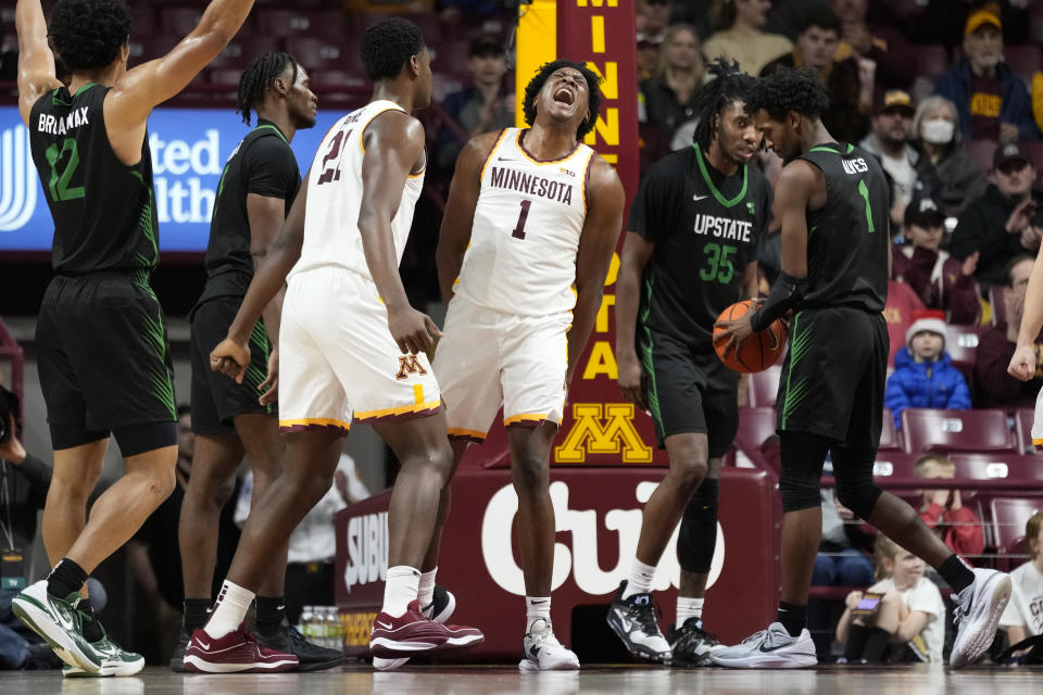 Minnesota forward Joshua Ola-Joseph (1) celebrates after making a basket while fouled during the second half of an NCAA college basketball game against USC Upstate, Saturday, Nov. 18, 2023, in Minneapolis. (AP Photo/Abbie Parr)