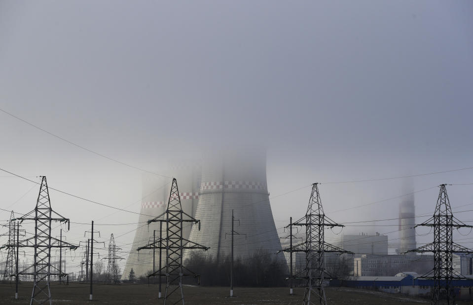 Partially covered by fog heating plant is seen in Minsk, Belarus, Thursday, Dec. 6, 2018. The two-week U.N. climate meeting COP24 in Poland is intended to finalize details of the 2015 Paris accord on keeping average global temperature increases well below 2 degrees Celsius (3.6 Fahrenheit). (AP Photo/Sergei Grits)