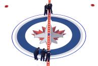 WINNIPEG, CANADA - JANUARY 8: Ice technicians install the Winnipeg Jets logo at centre ice at the MTS Centre on January 8, 2013 in Winnipeg, Manitoba, Canada. (Photo by Marianne Helm/Getty Images)