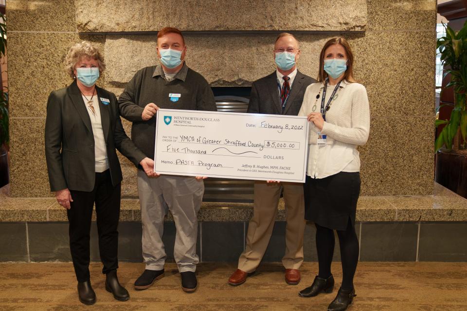 From left to right are Kim Harty, Granite YMCA; Rob Riley, Executive Director of the Granite YMCA Strafford County Branch; Jeffrey Hughes, President & CEO of Wentworth-Douglass Hospital; and Michelle Hanson, Director of Strategic Planning & Community Benefit