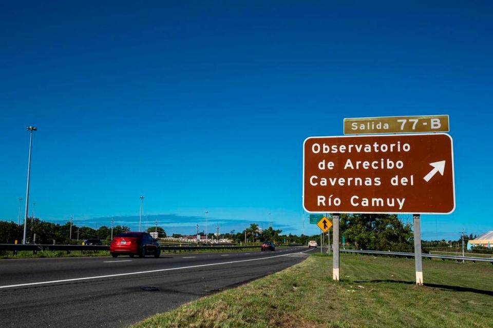 A road sign on the highway in Arecibo points the way to the Arecibo Observatory.