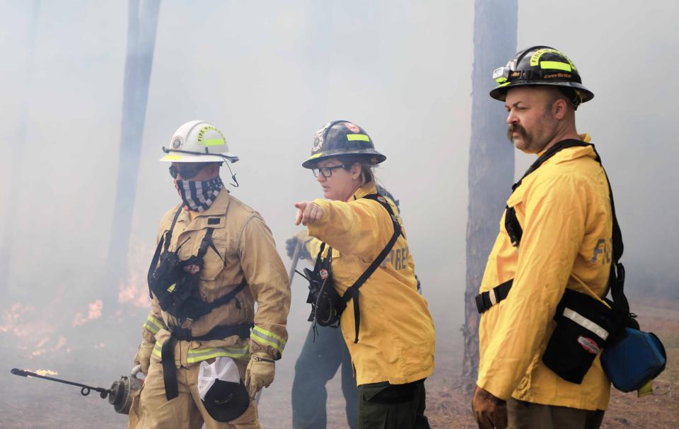 Volusia County Fire Fighter James Lucas (left), Volusia County Fire Lieutenant Kristi Campbell (middle) and Volusia Firefighter Matt Slifkin instruct Firefighter James Lucas where to go next during his training at the Southern Area Engine Academy on Tuesday, Jan.23, 2024.