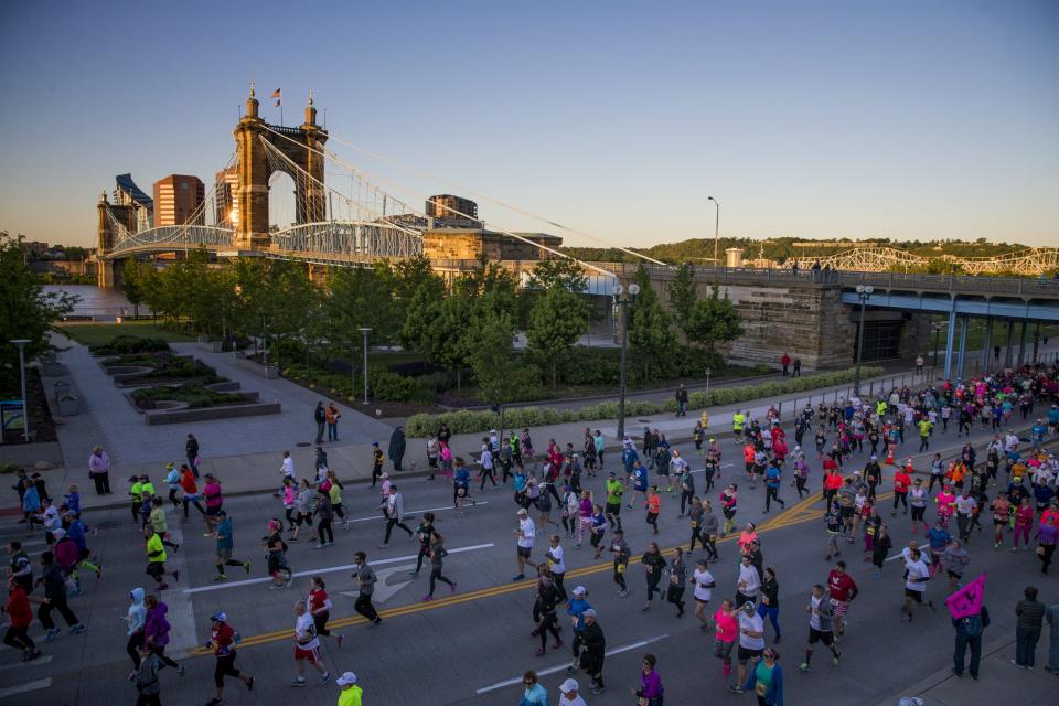 Participants run east on Mehring Way at the start of the 19th annual Flying Pig Marathon in 2017.