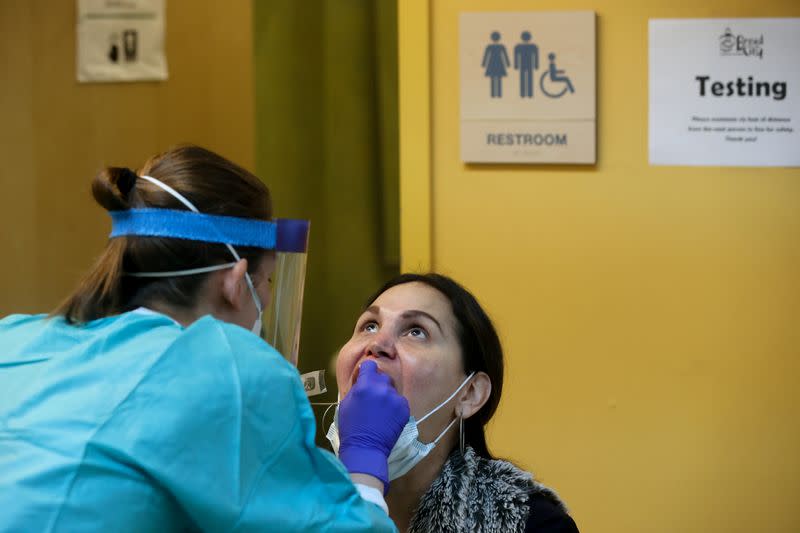 A client is seen for a free walk-in coronavirus test at the Bread for the City social services charity during the coronavirus disease (COVID-19) outbreak, in Washington