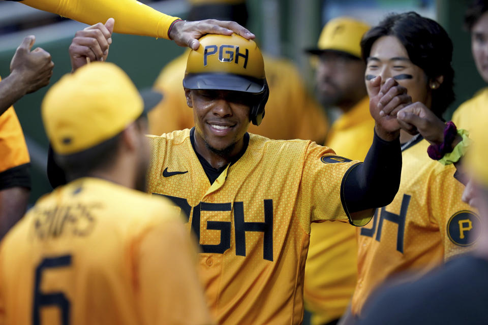 Pittsburgh Pirates' Ke'Bryan Hayes celebrates in the dugout after scoring against the Chicago Cubs on a groundout by Andrew McCutchen in the first inning of a baseball game in Pittsburgh, Friday, Aug. 25, 2023. (AP Photo/Matt Freed)