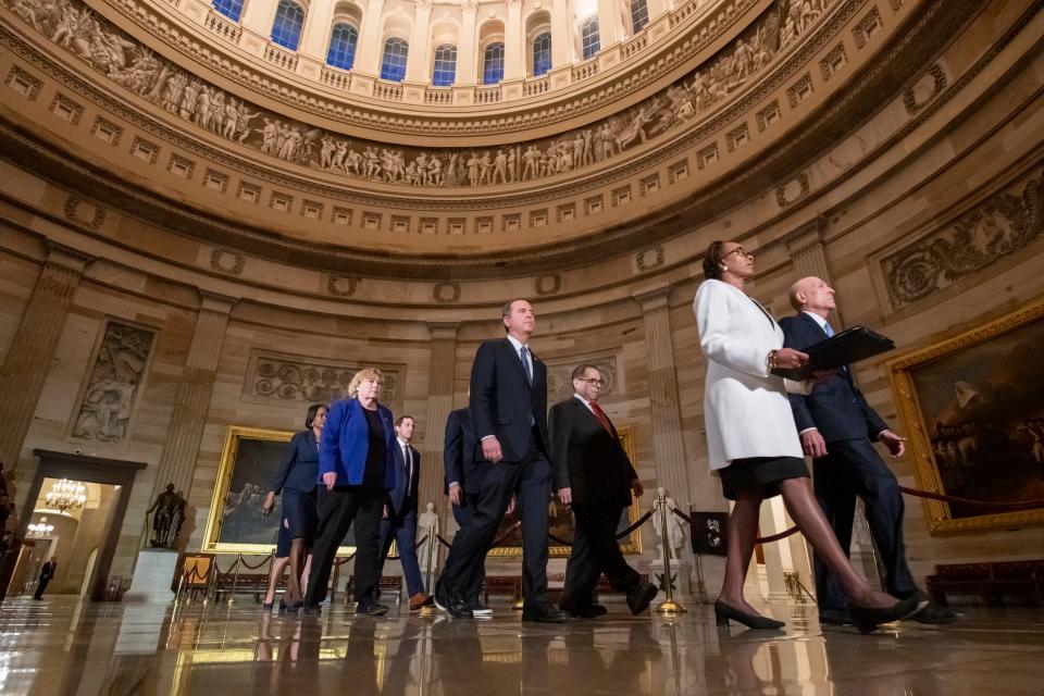 House impeachment managers walk through the Capitol Rotunda to present the articles to the Senate on Jan. 15, 2020.