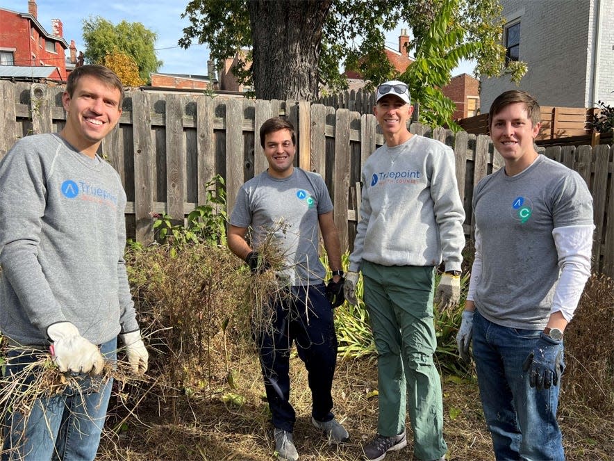 Truepoint Wealth Counsel workers participate in a community service project.