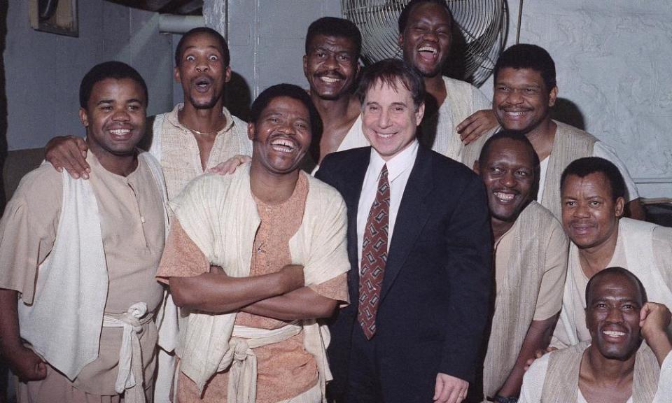 Joseph Shabalala, front left, with members of Ladysmith Black Mambazo, and Paul Simon, front right, in 1993. They worked with Simon on his Graceland project, and he produced their first international album.