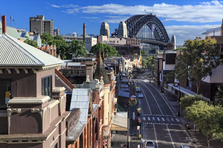 SYDNEY, AUSTRALIA – DECEMBER 1 2013; Early morning streetscape view of a part of the city of Sydney known as The Rocks. With Sydney Harbour Bridge.