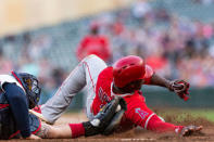 Jun 9, 2018; Minneapolis, MN, USA; Los Angeles Angels left fielder Justin Upton (8) is tagged out at home plate by Minnesota Twins catcher Bobby Wilson (46) during the eighth inning at Target Field. Mandatory Credit: Harrison Barden-USA TODAY Sports