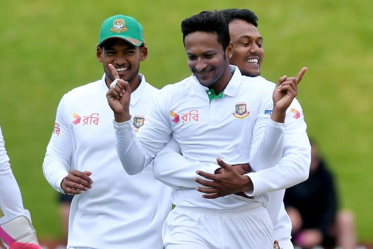 Bangladesh's Shakib Al Hasan (C) celebrates New Zealand's Tom Latham being caught with LBW with teammates Kamrul Islam Rabbi (R) and Nazmul Hossain Shanto on day four of their first Test match, at the Basin Reserve in Wellington, on January 15, 2017