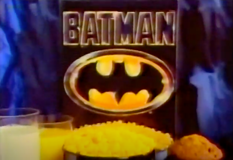 A screenshot of the Batman cereal box with a bowl of it, and a muffin