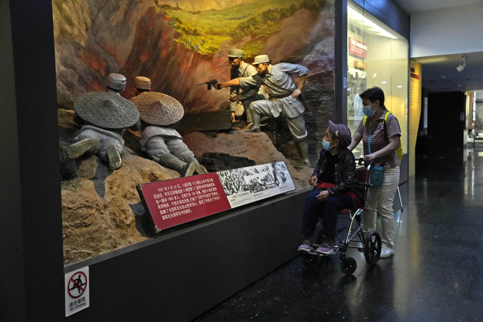 A visitor looks at diorama portraying Chinese soldiers at The Museum of the War of Chinese People's Resistance against Japan in Beijing, Tuesday, Sept. 27, 2022. Friend or foe? Or both? On the streets of Tokyo and Beijing, the ties between Japan and China remain complicated and often contradictory, 50 years after the two countries normalized relations as part of a process that brought communist China into the international fold. (AP Photo/Ng Han Guan)