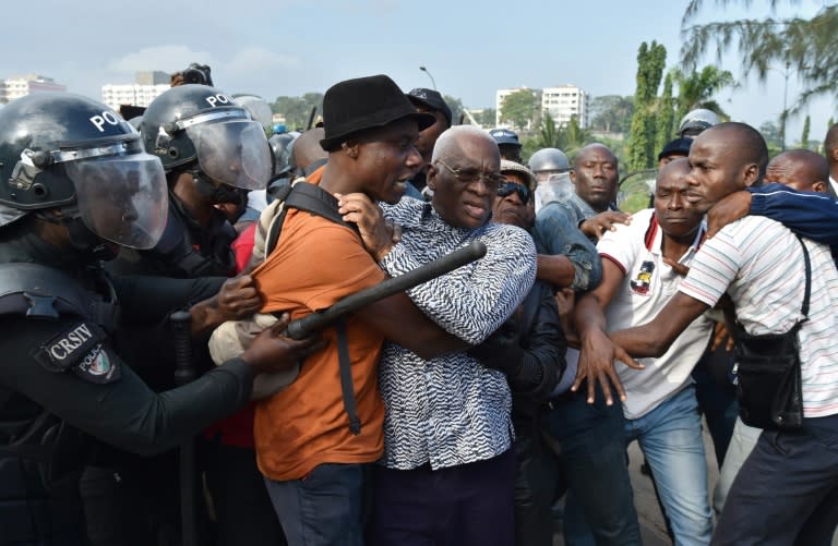 During a protest against the referendum campaign, several opposition leaders, including Aboudramane Sangare (C), were briefly detained, leaving some to believe the draft basic law is almost certain to garner a majority "yes" vote