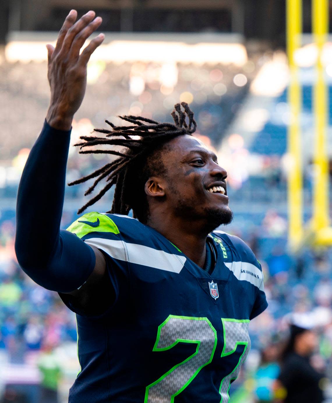 Seattle Seahawks cornerback Tariq Woolen (27) smiles and waves to fans as he runs into the tunnel after winning 19-9 against the Arizona Cardinals at an NFL game on Sunday, Oct. 16, 2022, at Lumen Field in Seattle.