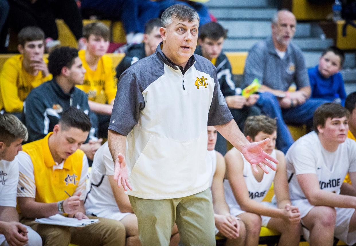 Monroe Central coach Justin Ullom instructs his team in a win over Daleville.