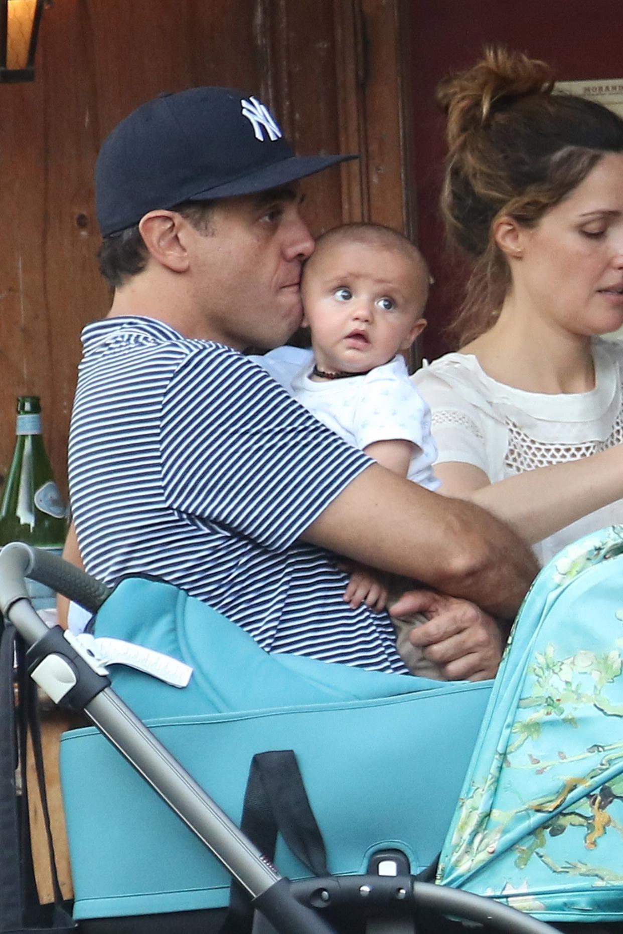 Bobby Cannavale nuzzled his adorable baby son as he enjoyed a meal with his wife Rose Byrne and family on May 31, 2016.
