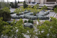 Spanish military tents are set out to be used by hospital patients during the coronavirus outbreak at the Gomez Ulla military hospital in Madrid, Spain, Friday, Sept. 18, 2020. A line of green tents have been installed at the gates of a Madrid military hospital four months after similar structures for triaging incoming patients and lighten up crammed emergency wards were taken down. (AP Photo/Manu Fernandez)