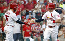 St. Louis Cardinals' Harrison Bader, right, is congratulated by Greg Garcia after hitting a solo home run during the third inning of a baseball game against the Washington Nationals on Thursday, Aug. 16, 2018, in St. Louis. (AP Photo/Jeff Roberson)