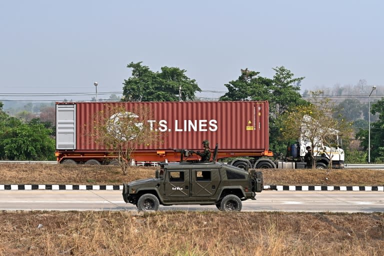 A handful of trucks arrived on the Thai side from Myanmar over the "2nd Friendship Bridge", according to AFP reporters (MANAN VATSYAYANA)