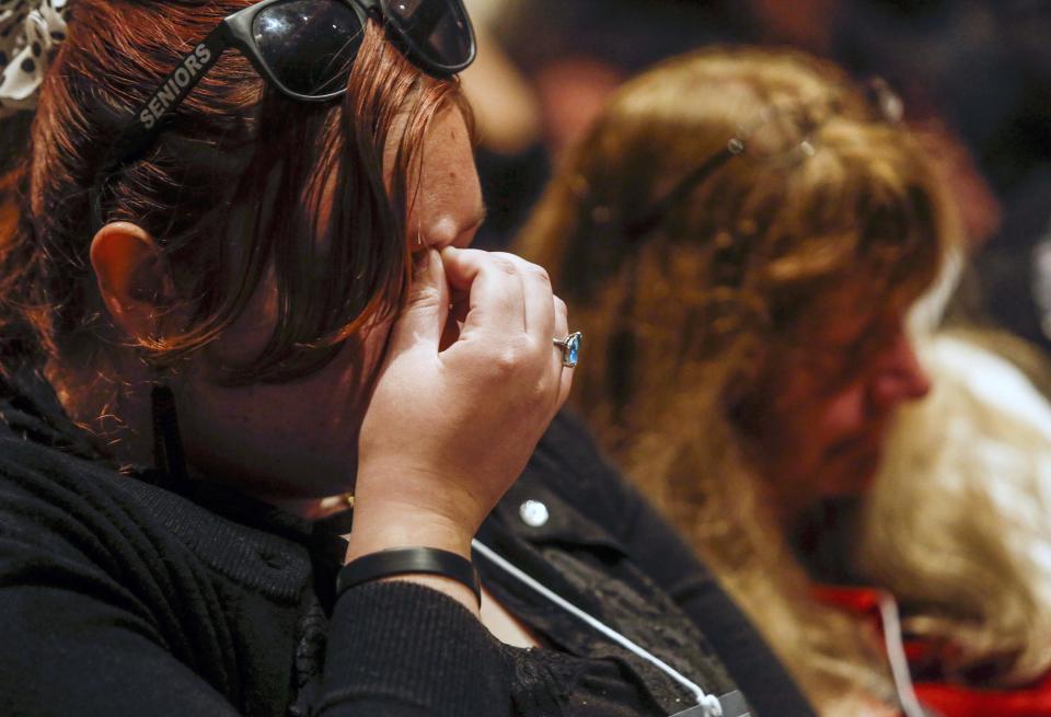 Renee Ruffcorn (L) reflects during a moment of silence at Humboldt State University for those killed when a truck slammed into a tour bus full of college hopefuls that was heading to the college for the Spring Preview, in Arcata, California April 11, 2014. Five students, three chaperones and the drivers of the bus and FedEx truck were killed, according to the California Highway Patrol and Humboldt State University, which was to host the students' visit. REUTERS/Nick Adams (UNITED STATES - Tags: SOCIETY TRANSPORT)