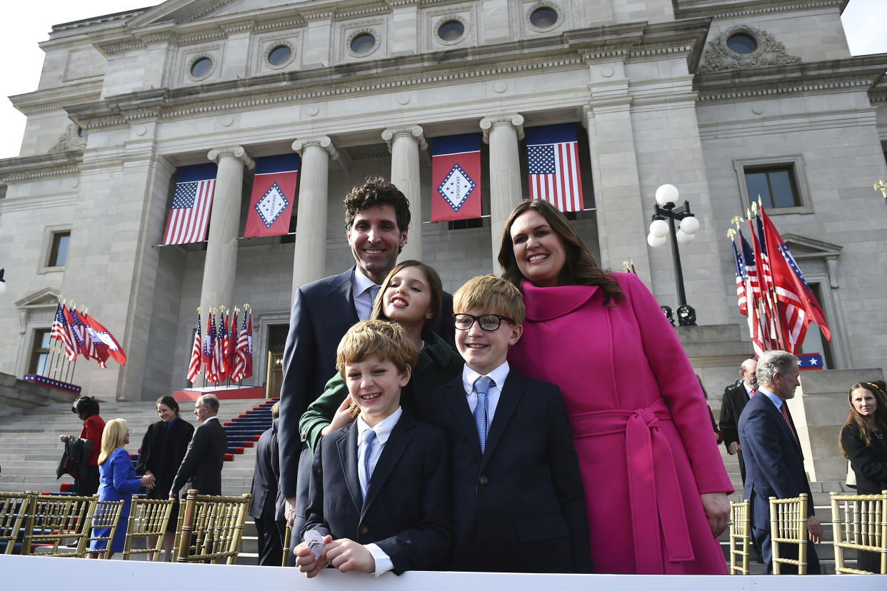 Arkansas Gov. Sarah Huckabee Sanders poses for a picture with husband Bryan and children Scarlett, Huck, and George after taking the oath of the office on the steps of the Arkansas Capitol Tuesday, Jan. 10, 2023, in Little Rock, Ark. (AP Photo/Will Newton)