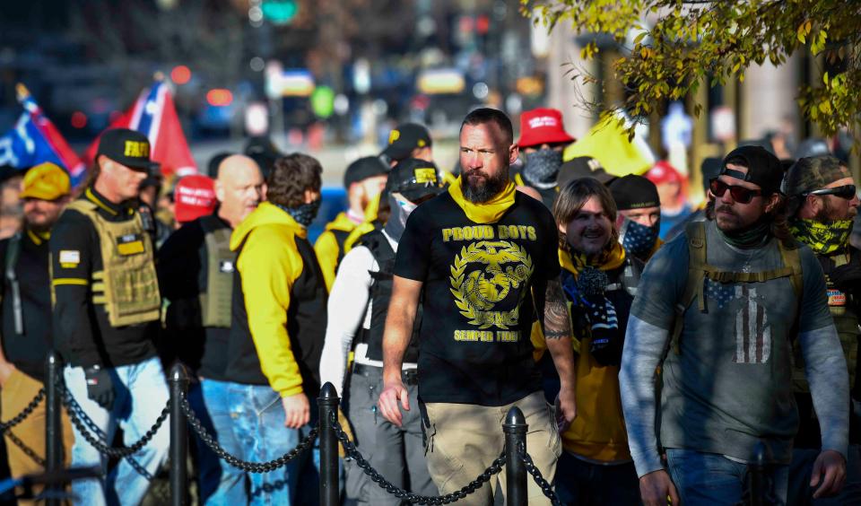 Members of the Proud Boys march near the White House and Black Lives Matter Plaza on Dec 12, 2020.